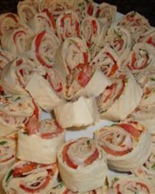 Рулетики из лаваша с семгой и ветчиной